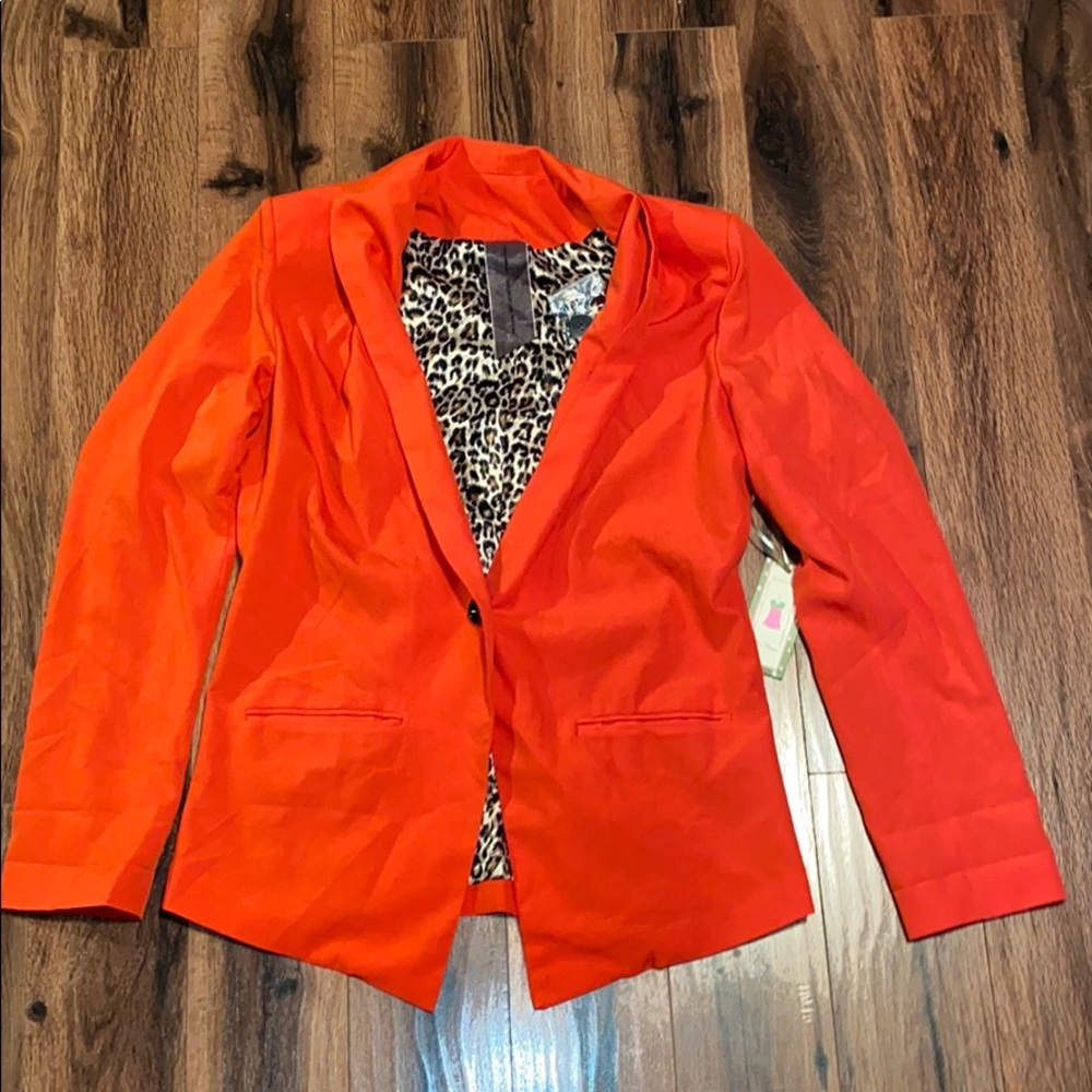 Red blazer with leopard print lining